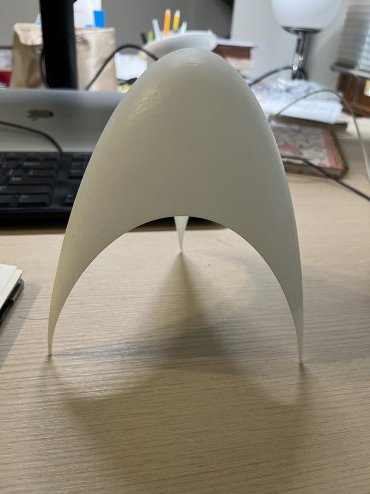 3D print of the entropy surface seen from the side: a white dome standing on three thin legs